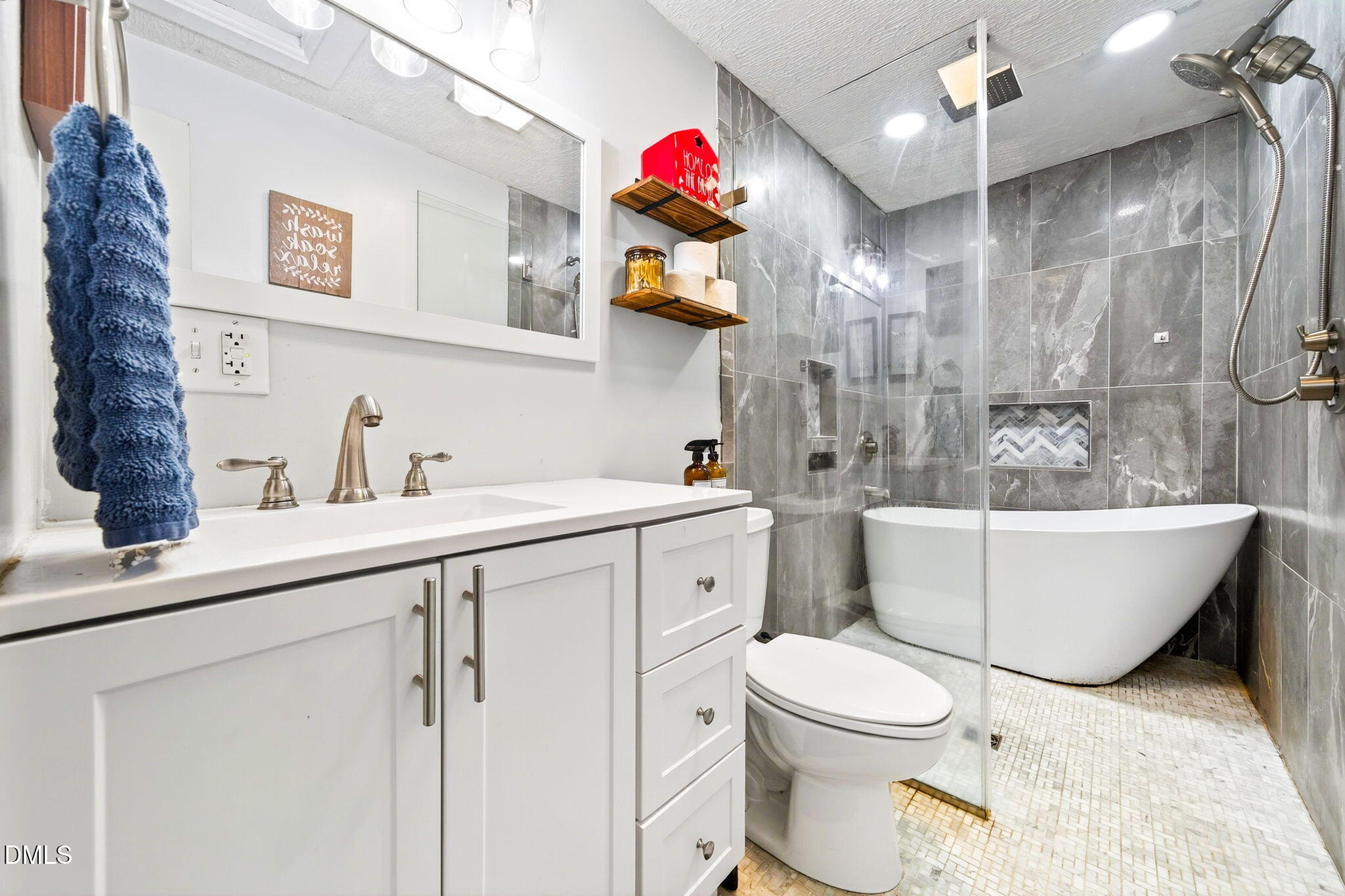 334 Perry Curtis Road Zebulon, NC 27597 - Photo 24 of 38 a bathroom with a sink toilet mirror and shower