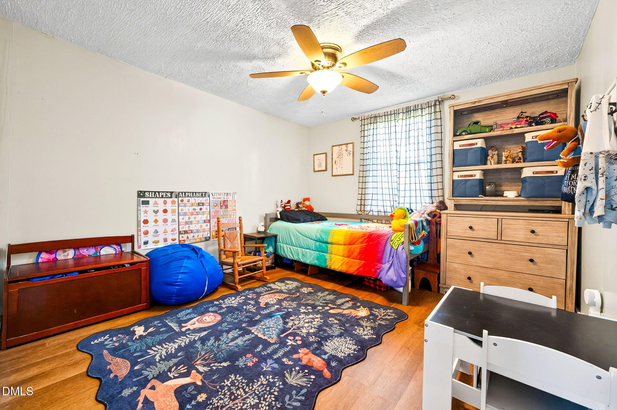 334 Perry Curtis Road Zebulon, NC 27597 - Photo 25 of 38 a bedroom with furniture and a window