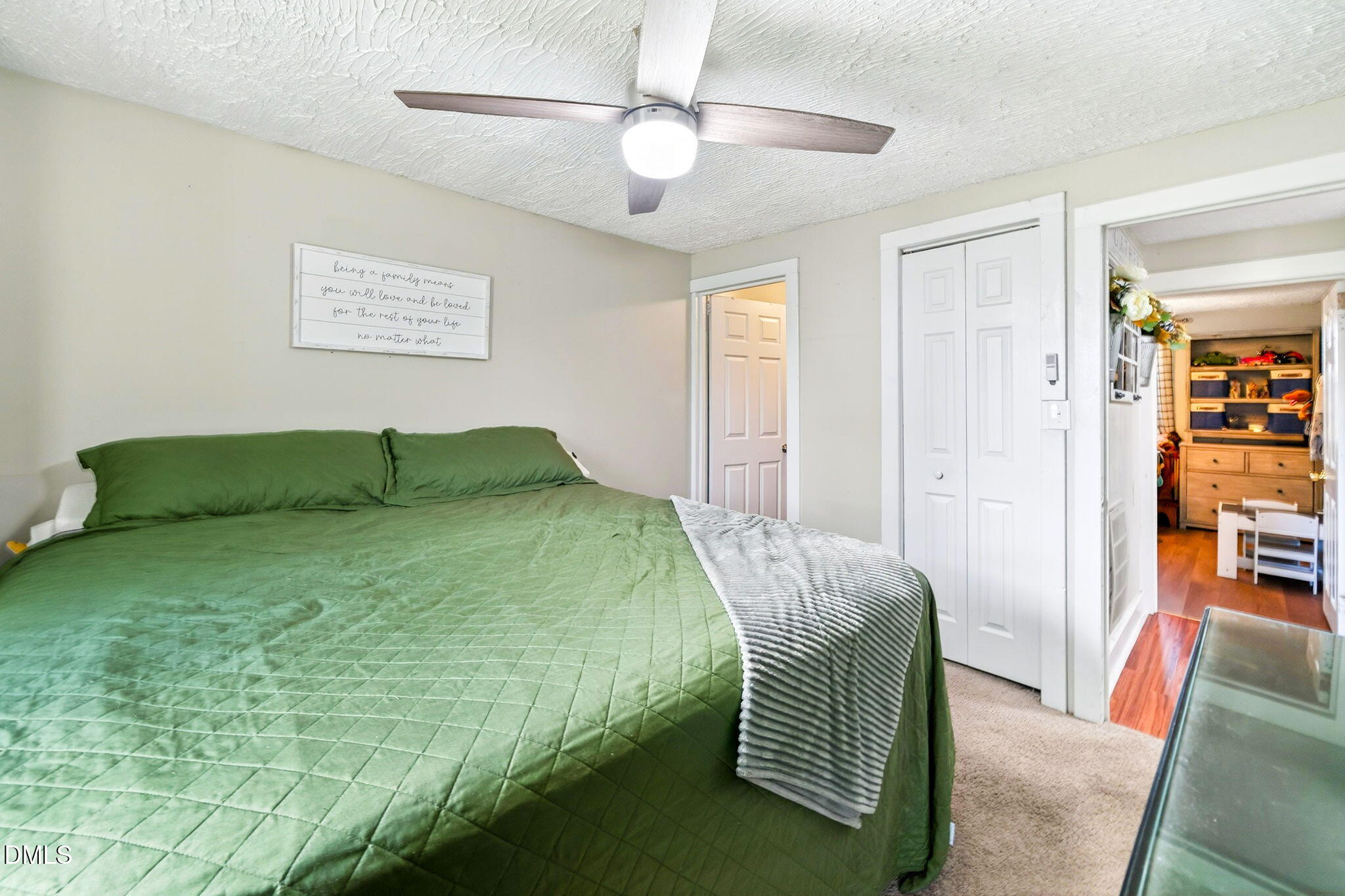 334 Perry Curtis Road Zebulon, NC 27597 - Photo 28 of 38 a bedroom with a bed and a couch