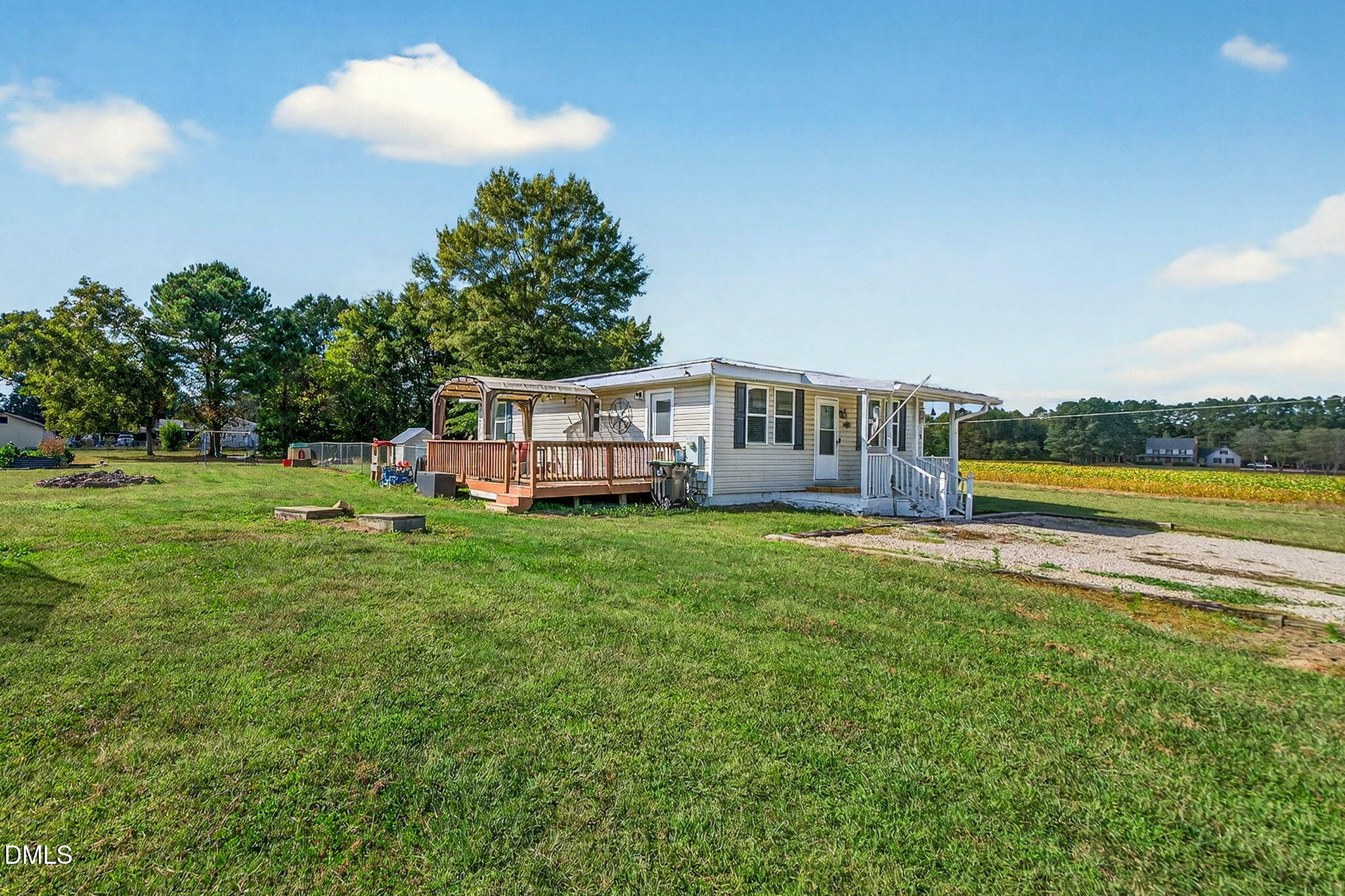 334 Perry Curtis Road Zebulon, NC 27597 - Photo 32 of 38 a view of a house with a yard and sitting area