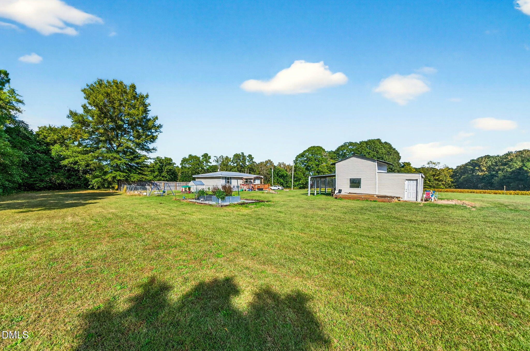 334 Perry Curtis Road Zebulon, NC 27597 - Photo 34 of 38 a front view of house with yard and seating area
