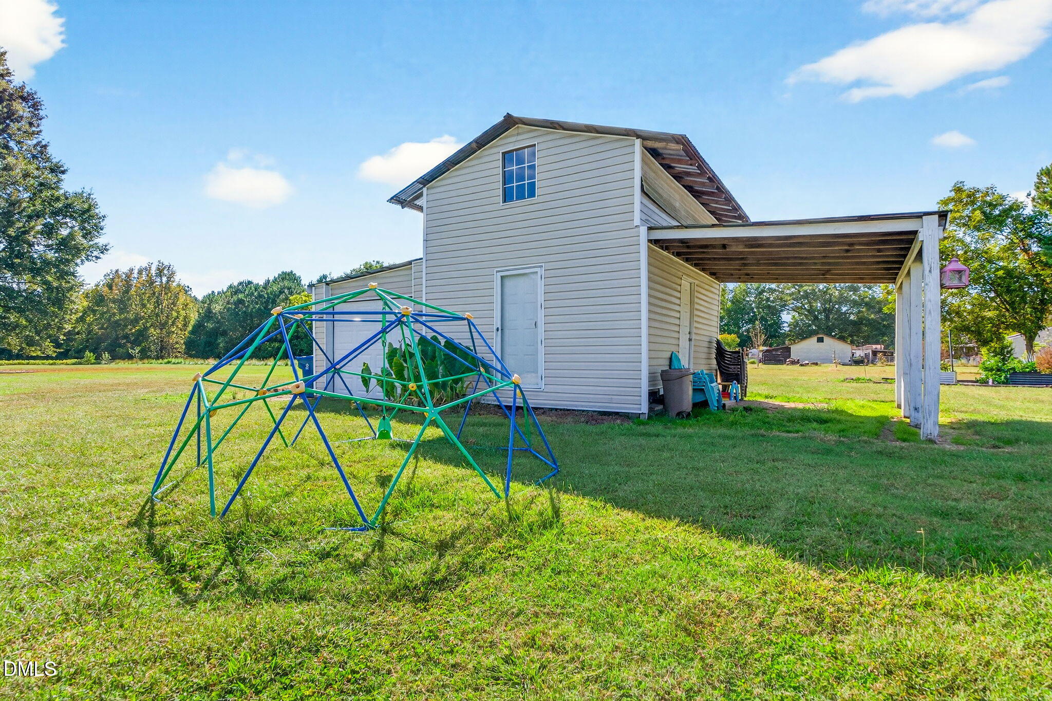 334 Perry Curtis Road Zebulon, NC 27597 - Photo 37 of 38 a house view with a garden space