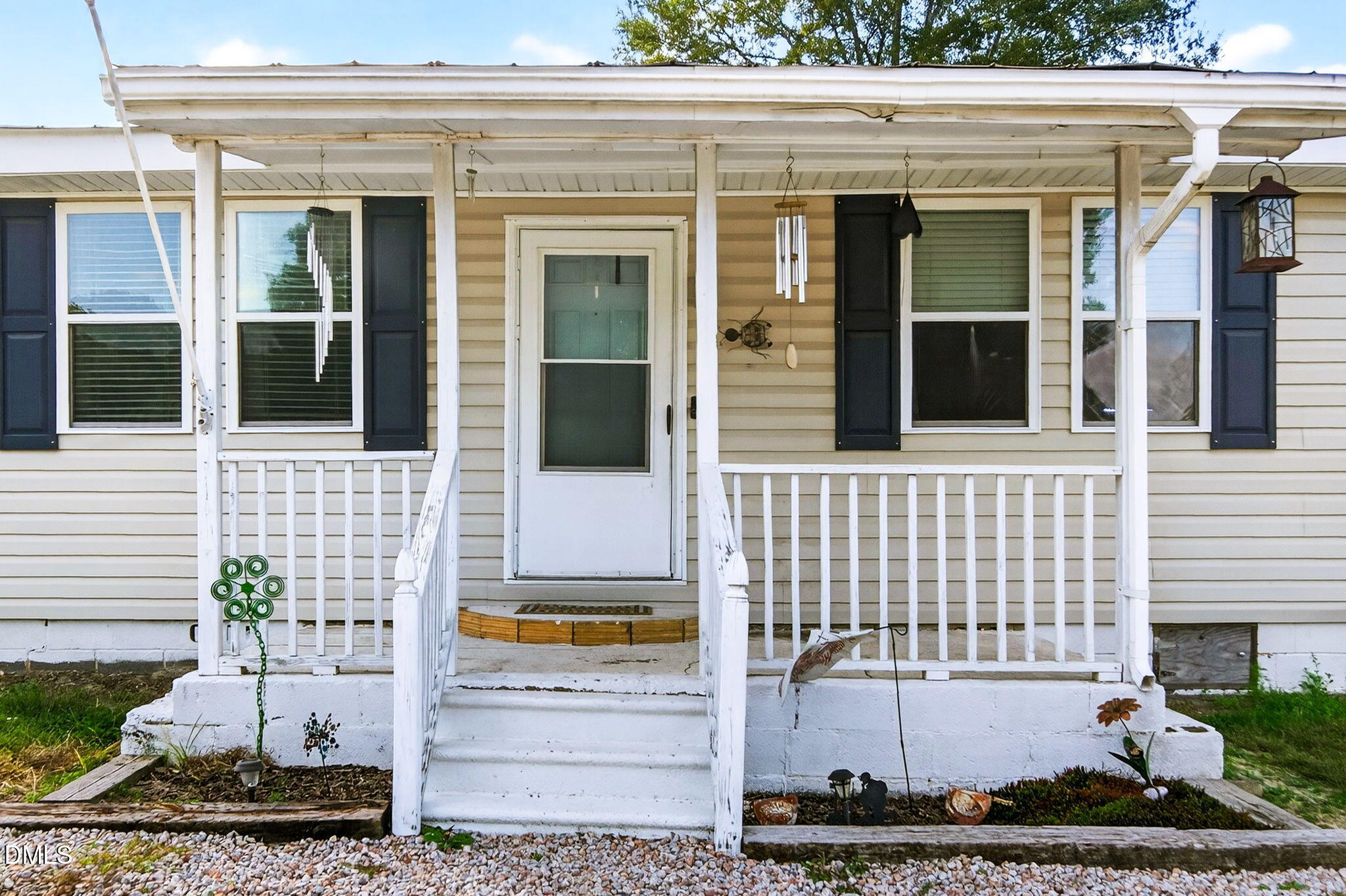 334 Perry Curtis Road Zebulon, NC 27597 - Photo 8 of 38 a front view of a house with a garden