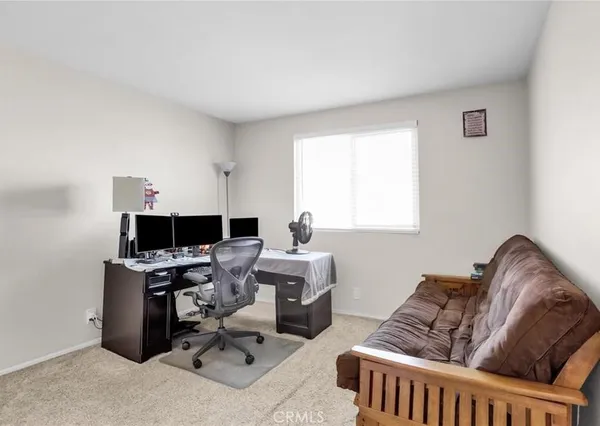 a workspace with furniture and window
