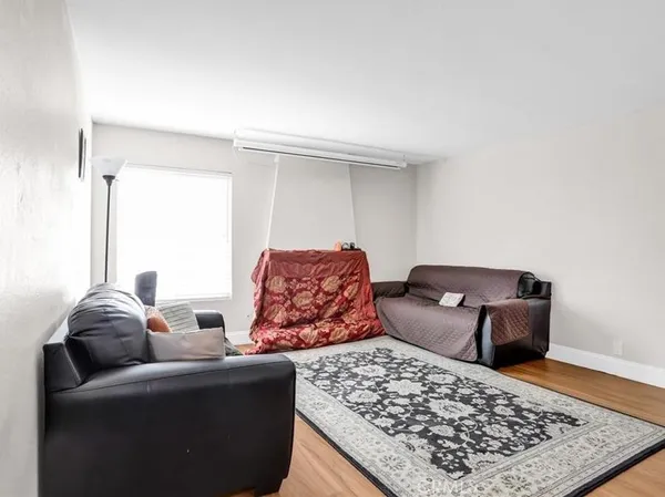 a living room with a couch and a rug