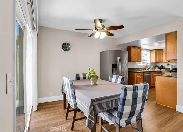 a view of a dining room with furniture and wooden floor