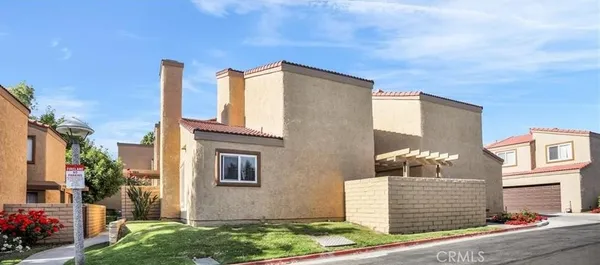 a front view of a house with parking