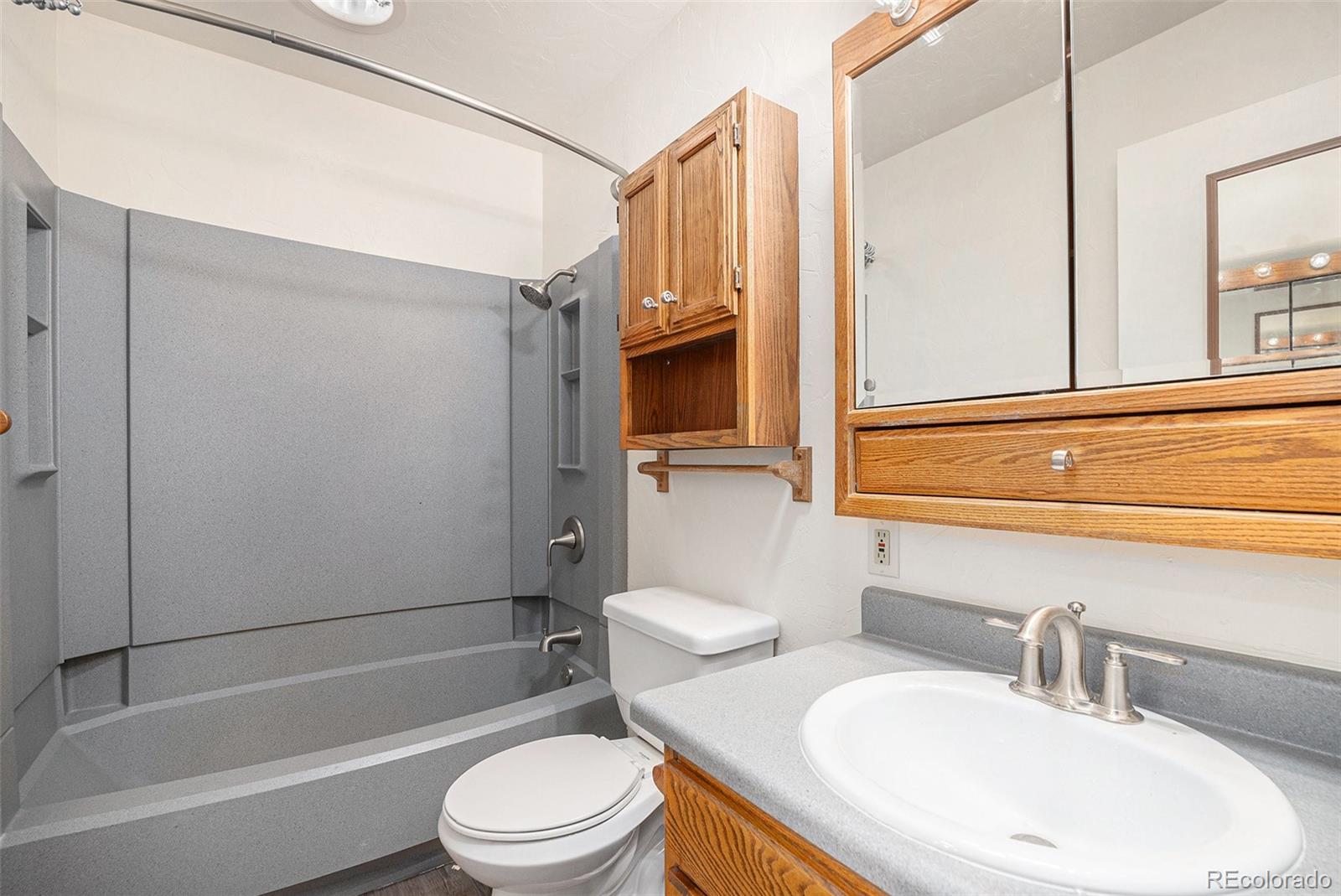 11540 Inspiration Road Golden, CO 80403 - Photo 11 of 33 a bathroom with a toilet a sink and bathtub