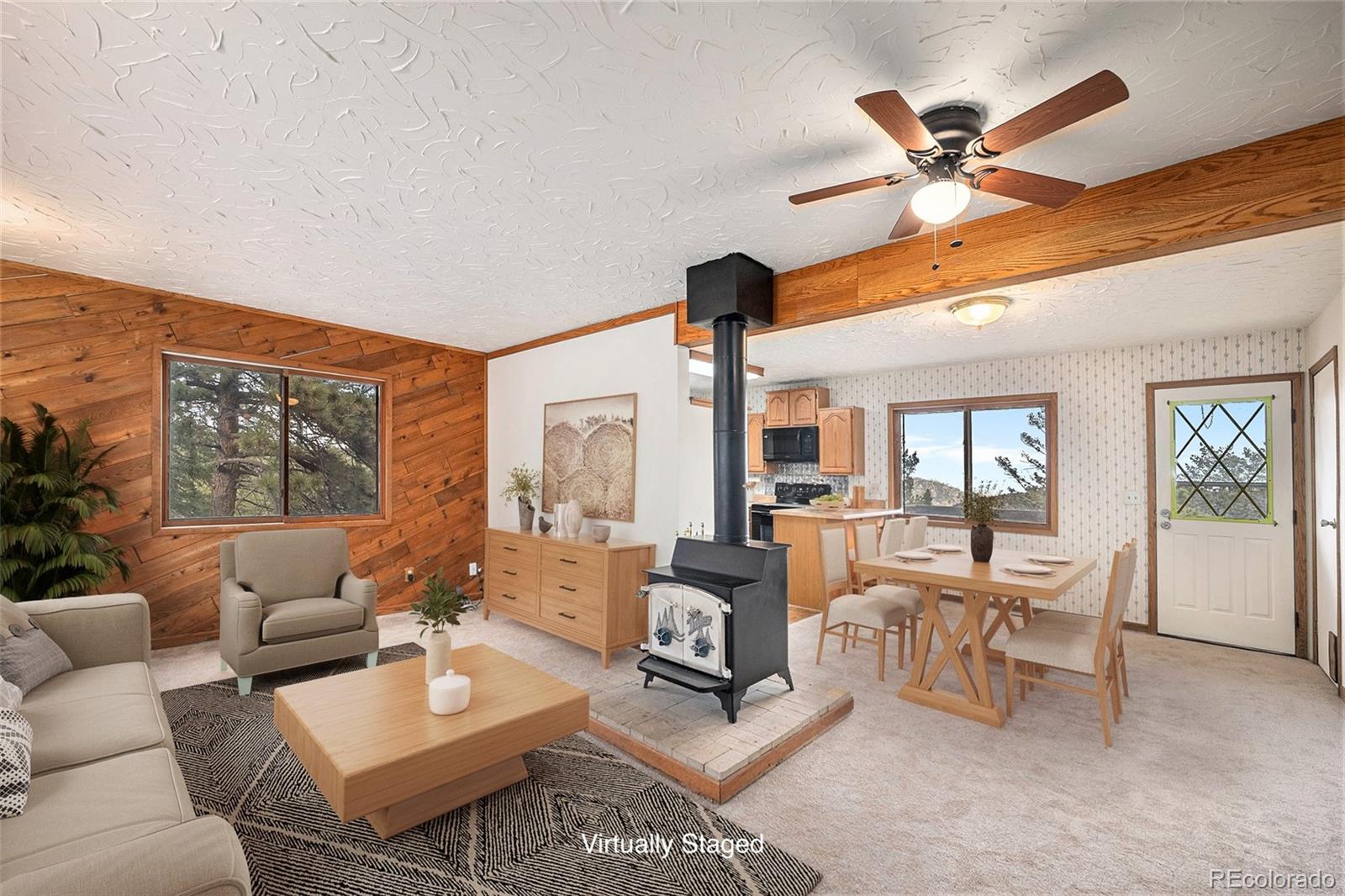 11540 Inspiration Road Golden, CO 80403 - Photo 3 of 33 a living room with furniture and a large window