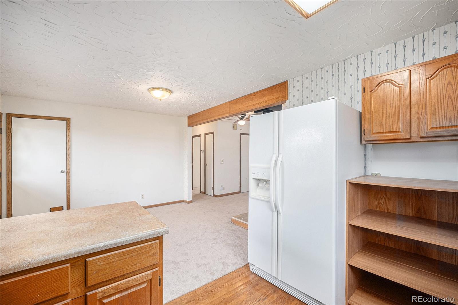 11540 Inspiration Road Golden, CO 80403 - Photo 10 of 33 a room with a bed and cabinets