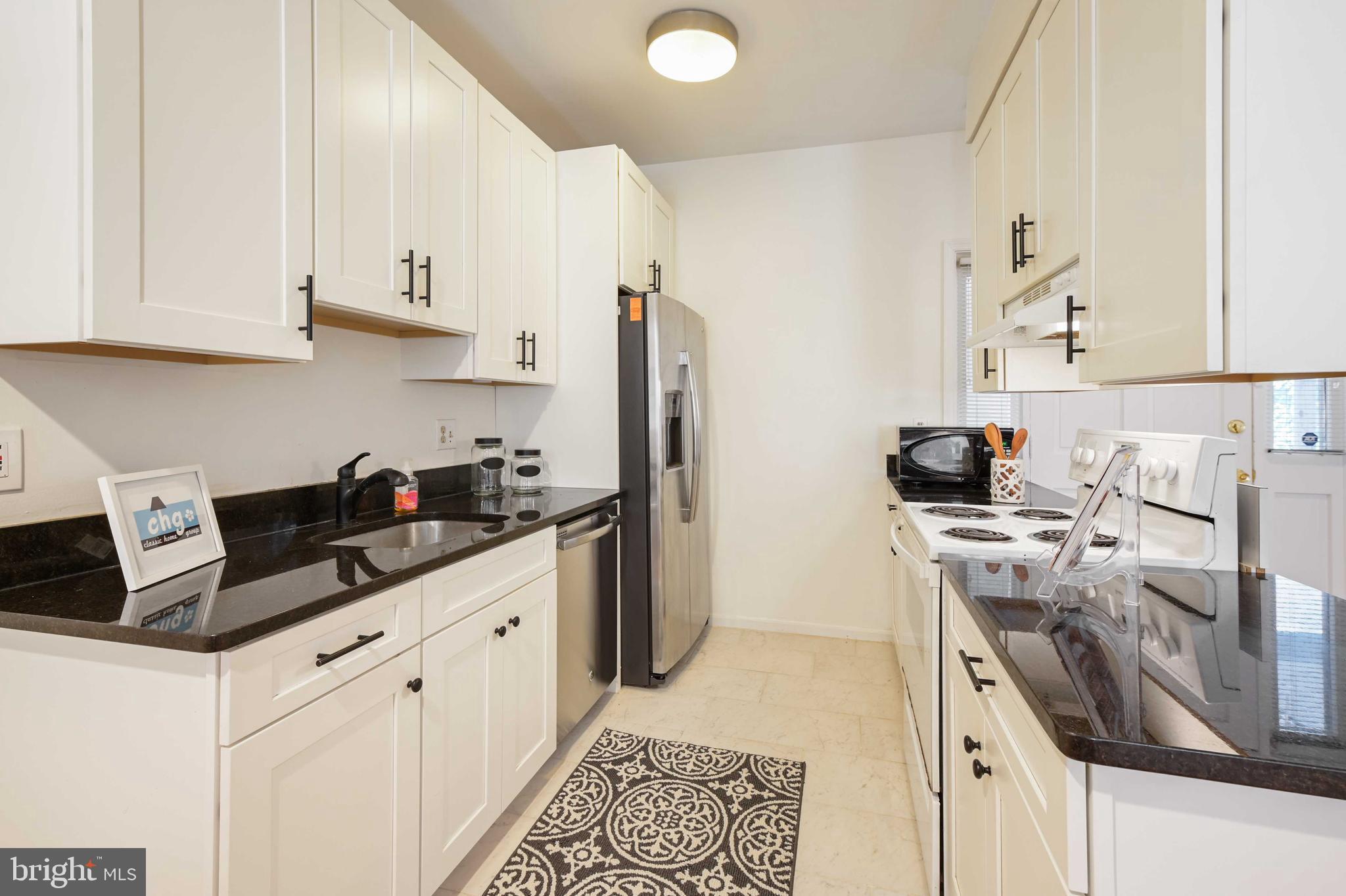 4202 Roland Avenue, Unit 104 Baltimore, MD 21211 - Photo 11 of 37 Updated kitchen with granite countertops