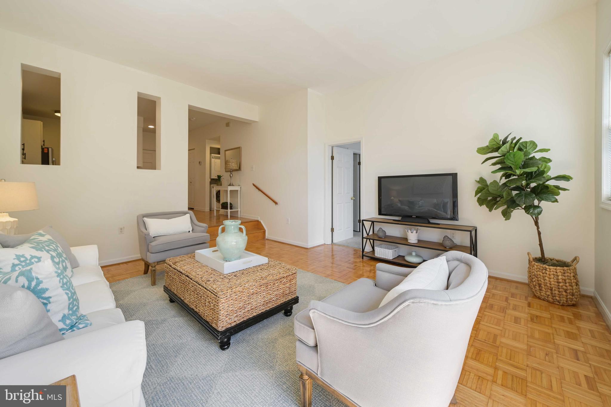 4202 Roland Avenue, Unit 104 Baltimore, MD 21211 - Photo 16 of 37 Living room with Parquet flooring