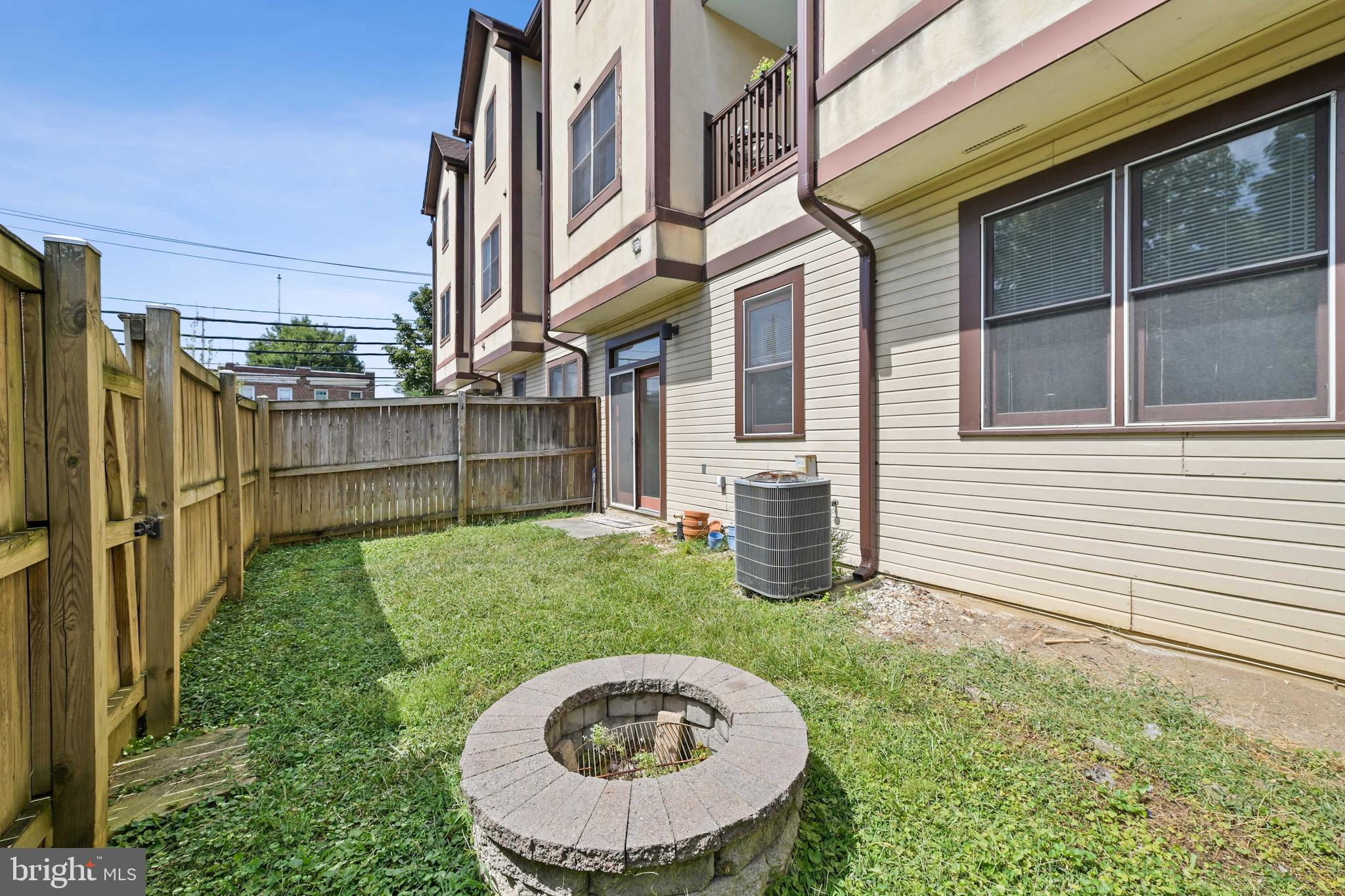 4202 Roland Avenue, Unit 104 Baltimore, MD 21211 - Photo 32 of 37 Back yard with fire pit