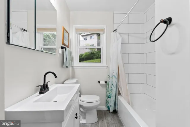 a bedroom with a large bed and a tv on table