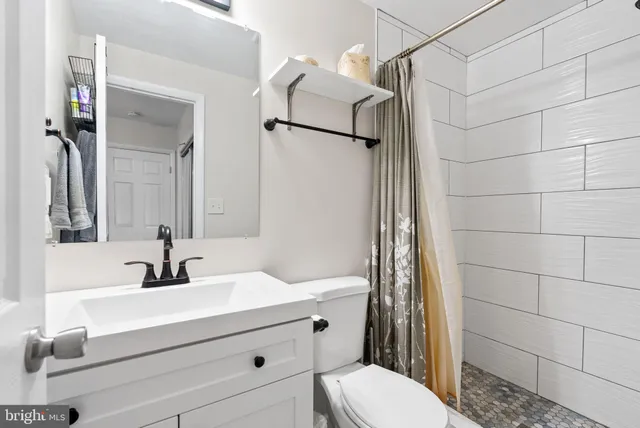 a view of a livingroom with furniture and a window