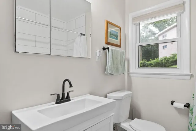 a kitchen with stainless steel appliances granite countertop a stove and a wooden floors