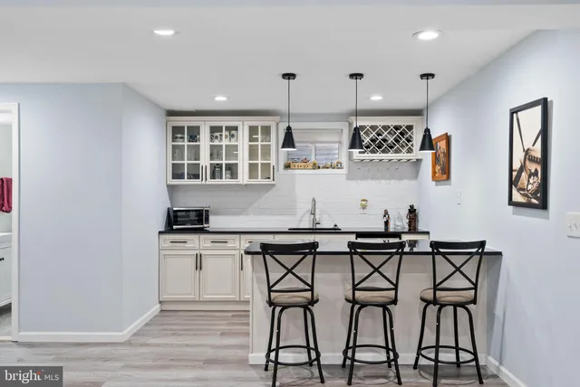 a view of an outside dining space with furniture and garden