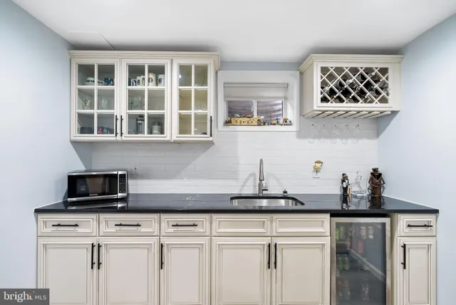 a car parked in front of a house with a yard