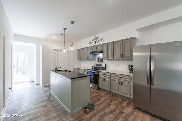 a bedroom with a large bed mirror and a window