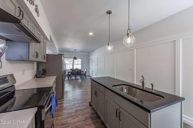 a bedroom with a bed a table and chair