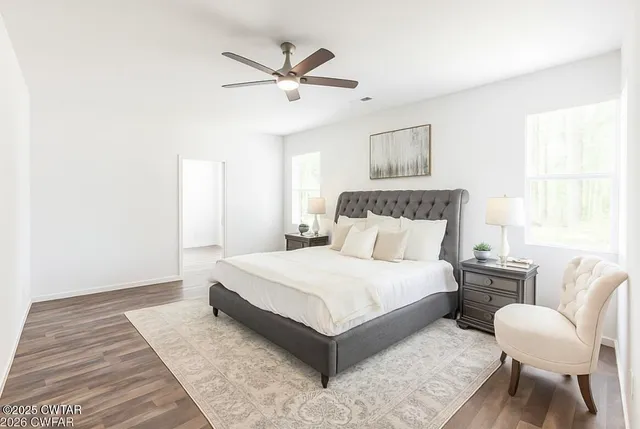 a bathroom with a double vanity sink and mirror with shower