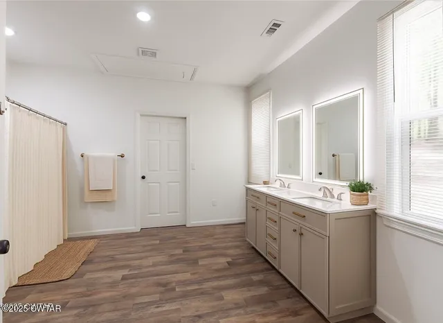 a bathroom with a sink toilet tub and shower