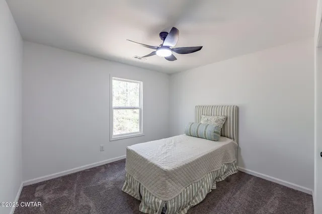 a bathroom with a toilet a sink a vanity and mirror