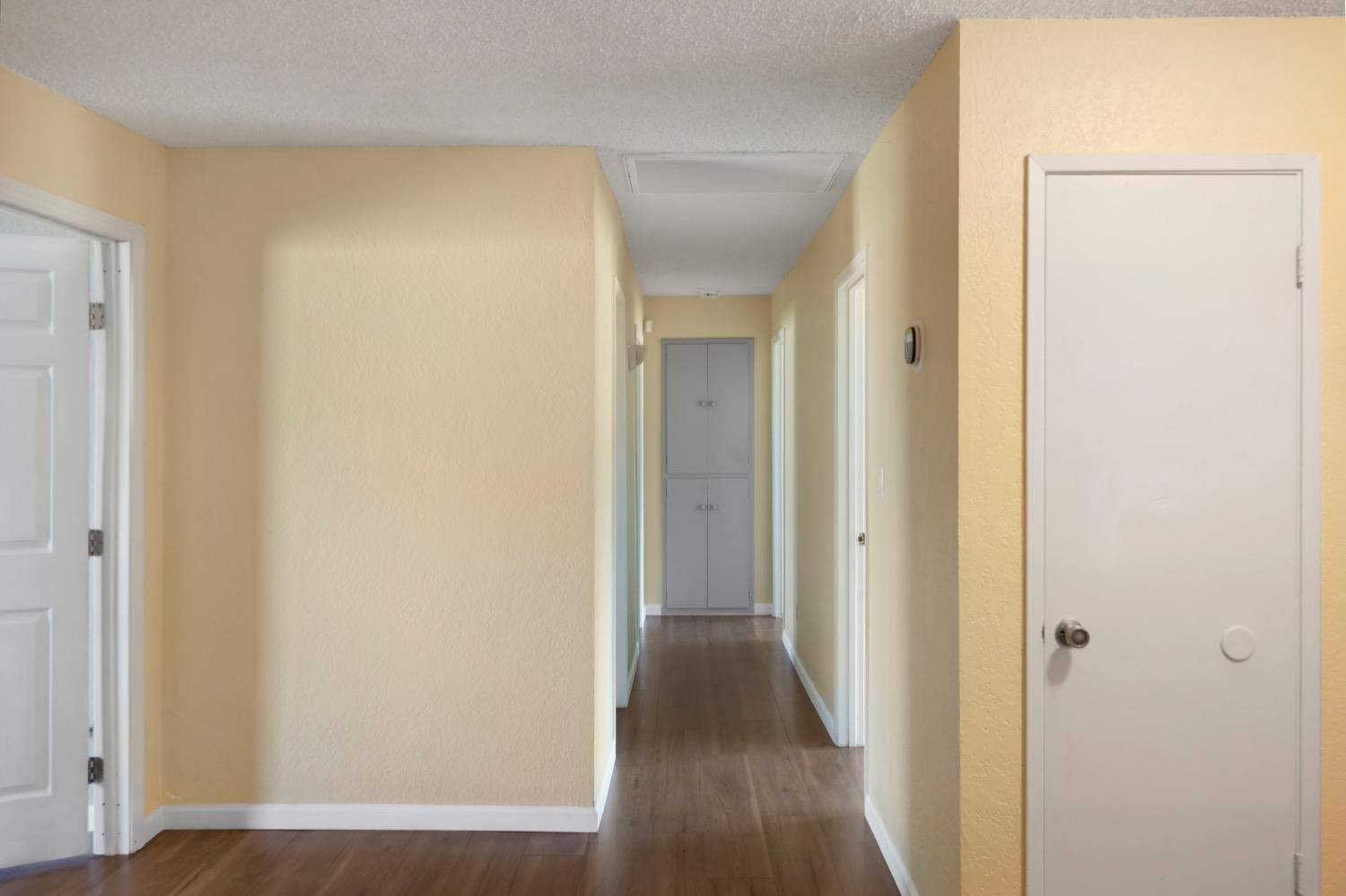 948 Harvard Avenue Clovis, CA 93612 - Photo 12 of 26 a view of a hallway with wooden floor