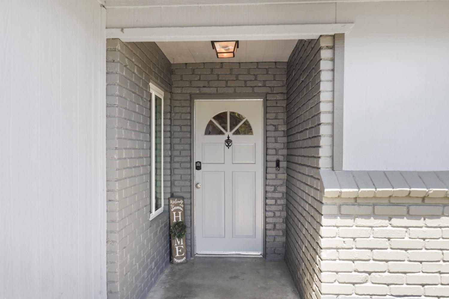 948 Harvard Avenue Clovis, CA 93612 - Photo 2 of 26 a front view of a house with a door