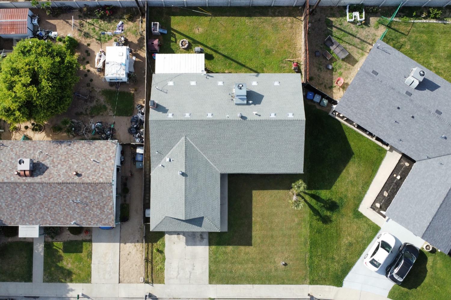 948 Harvard Avenue Clovis, CA 93612 - Photo 26 of 26 an aerial view of a house with a yard and large tree