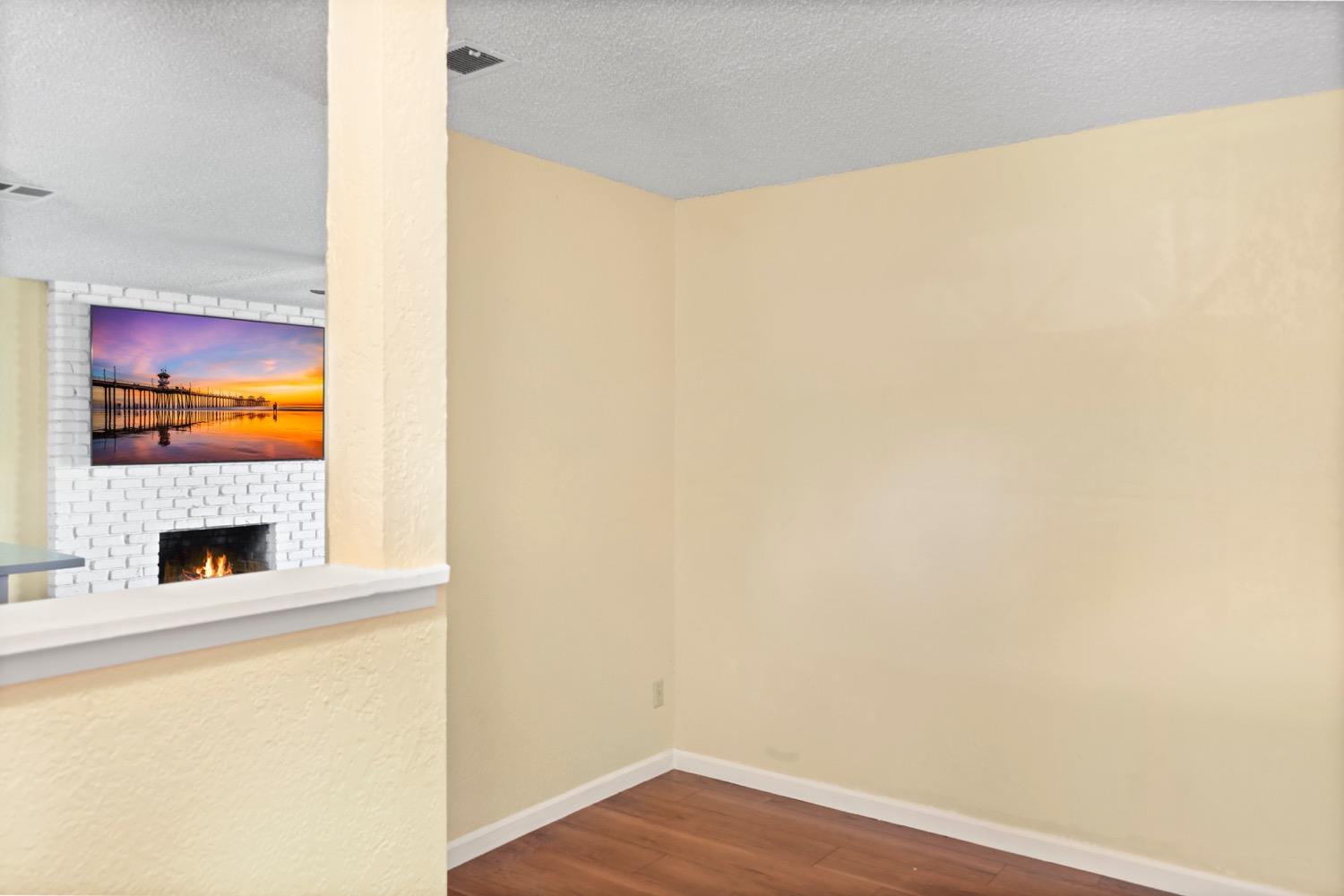 948 Harvard Avenue Clovis, CA 93612 - Photo 10 of 26 a view of an empty room with wooden floor