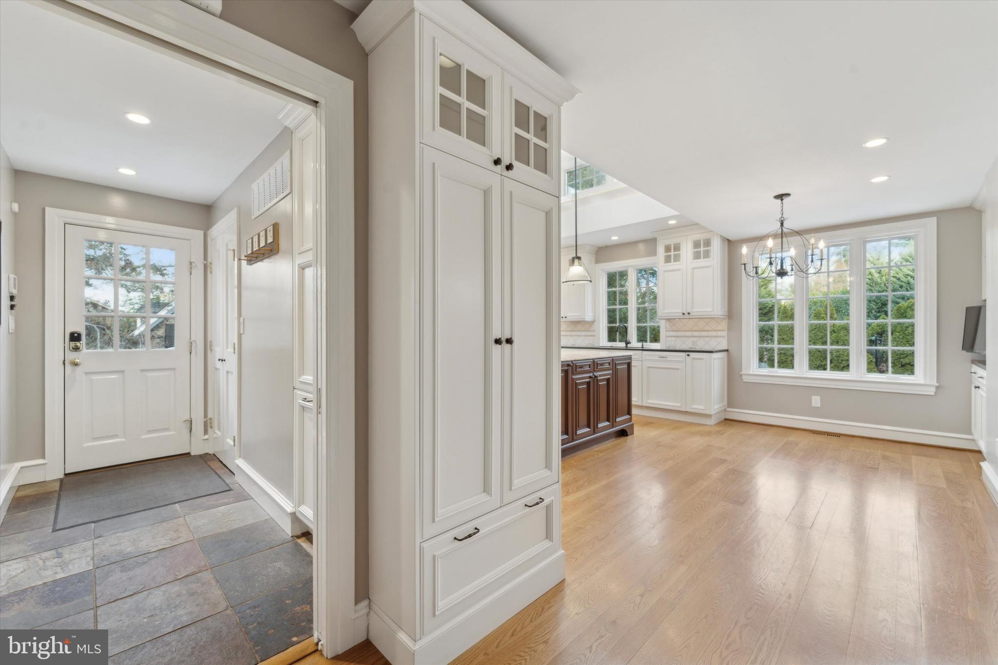 101 East Brookhaven Road Wallingford, PA 19086 - Photo 12 of 60 a view of a hallway with wooden floor and a cabinet