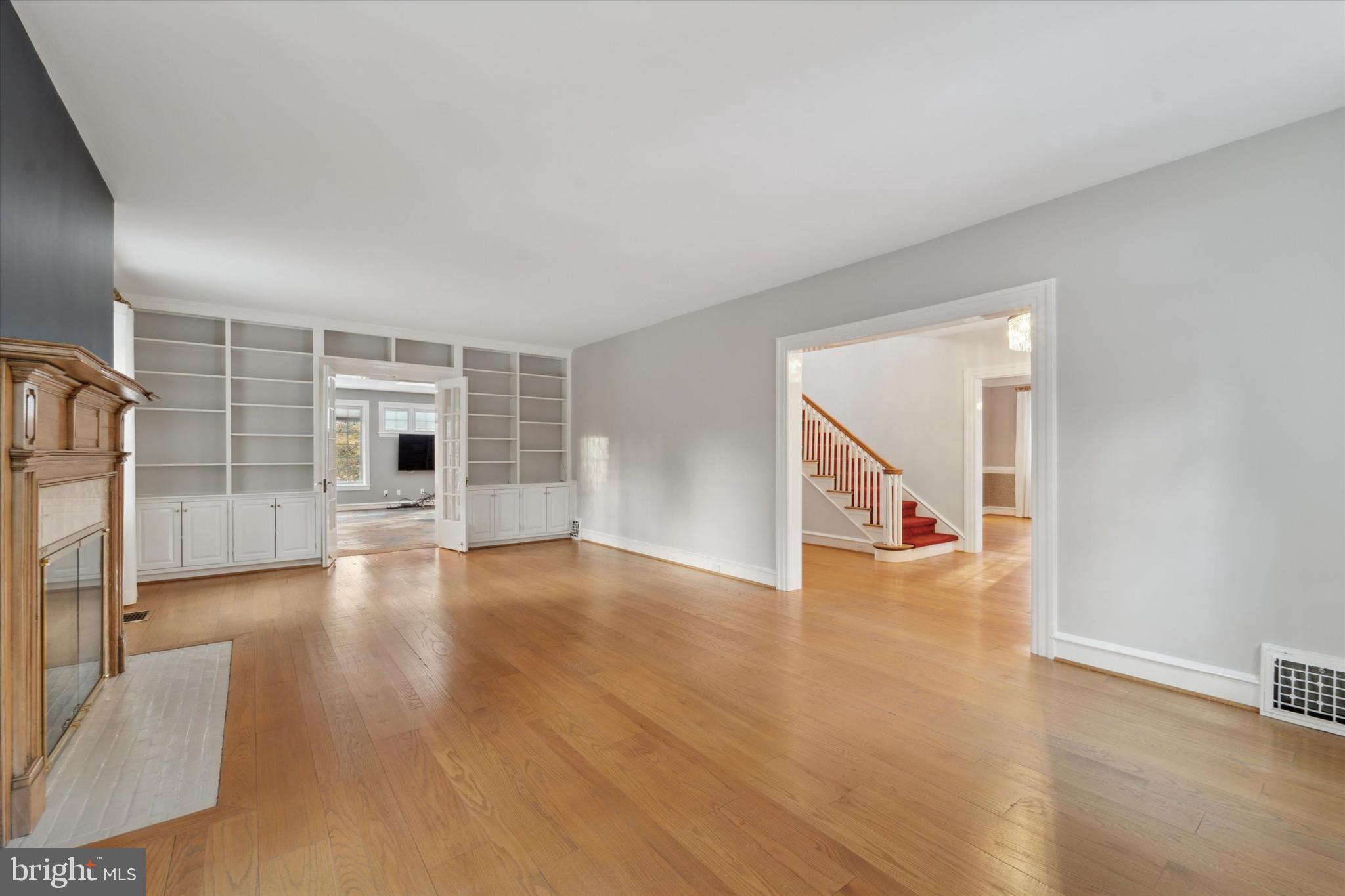 101 East Brookhaven Road Wallingford, PA 19086 - Photo 4 of 60 a view of an empty room with wooden floor and a window