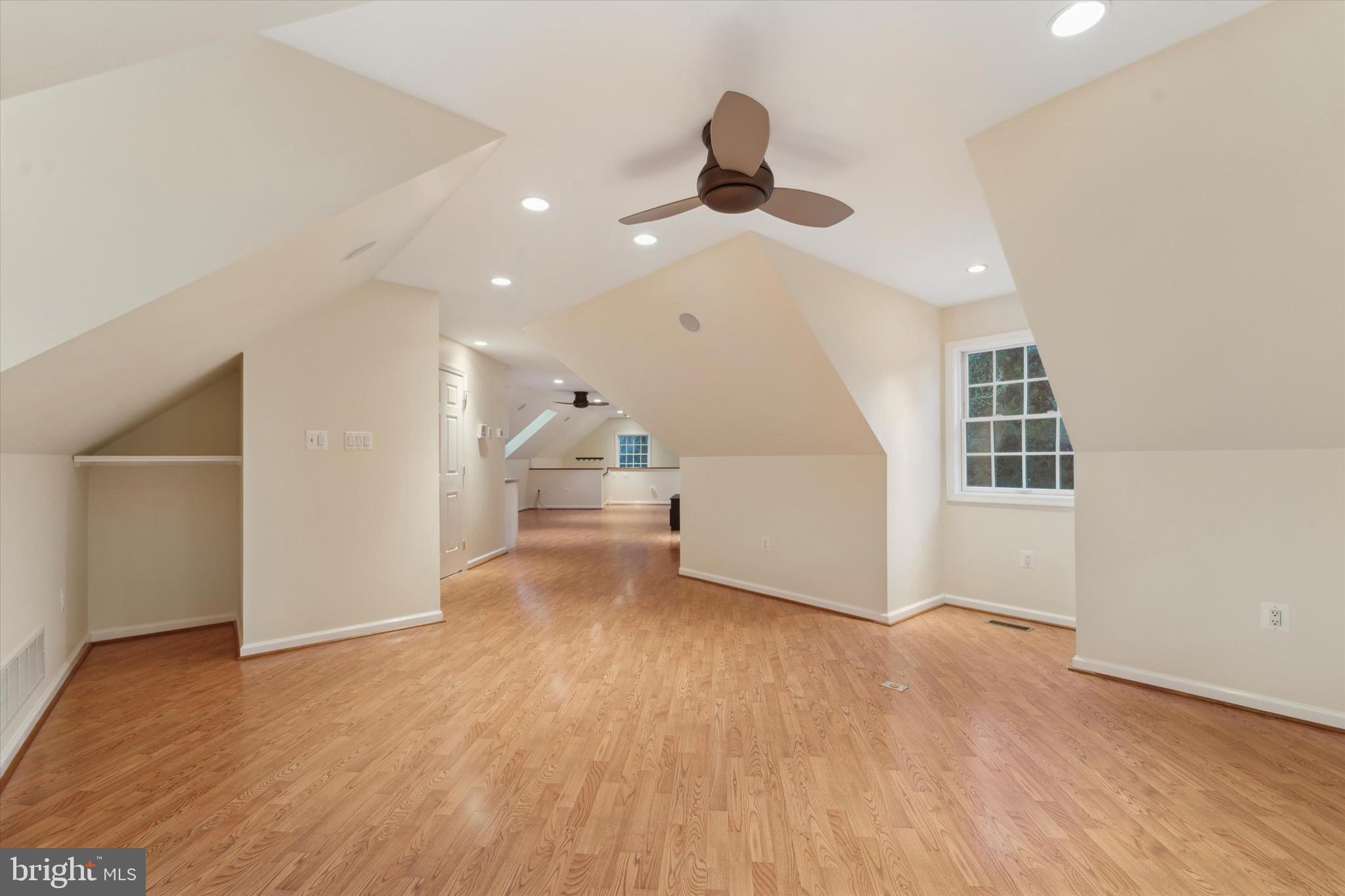 101 East Brookhaven Road Wallingford, PA 19086 - Photo 45 of 60 a view of a livingroom with wooden floor and a ceiling fan
