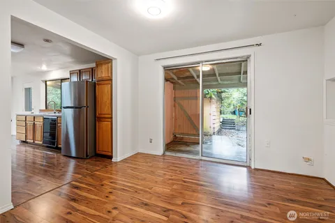 a kitchen with stainless steel appliances a stove top oven and a refrigerator
