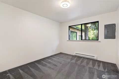 a bathroom with a sink toilet a mirror and shower