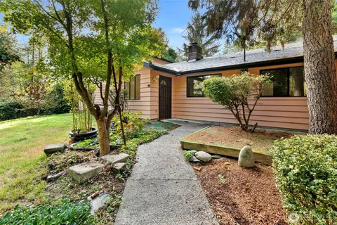 a view of a back yard of the house and a garden