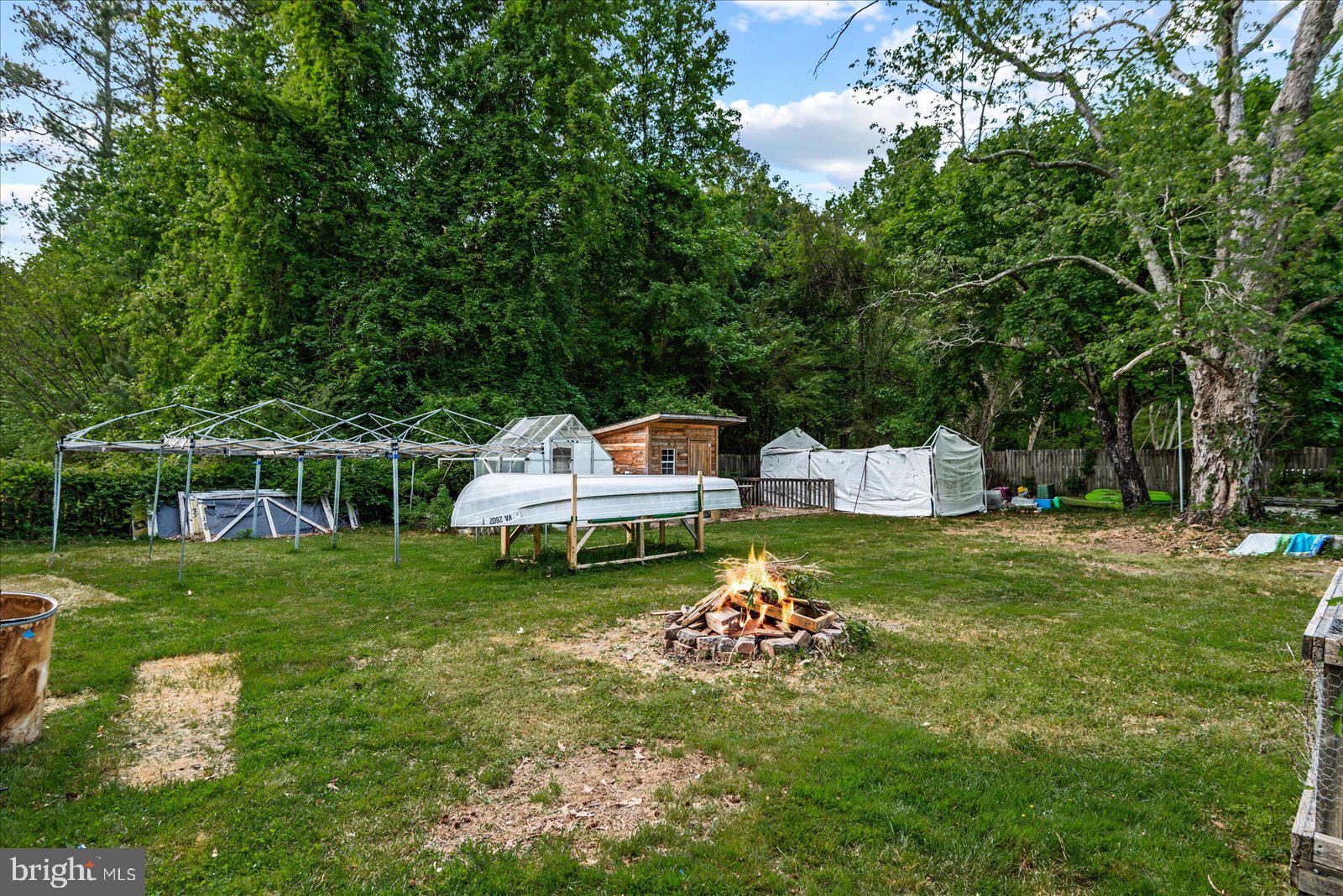797 Forest Grove Road Colonial Beach, VA 22443 - Photo 28 of 38 Greenhouse and Shed with sitting area