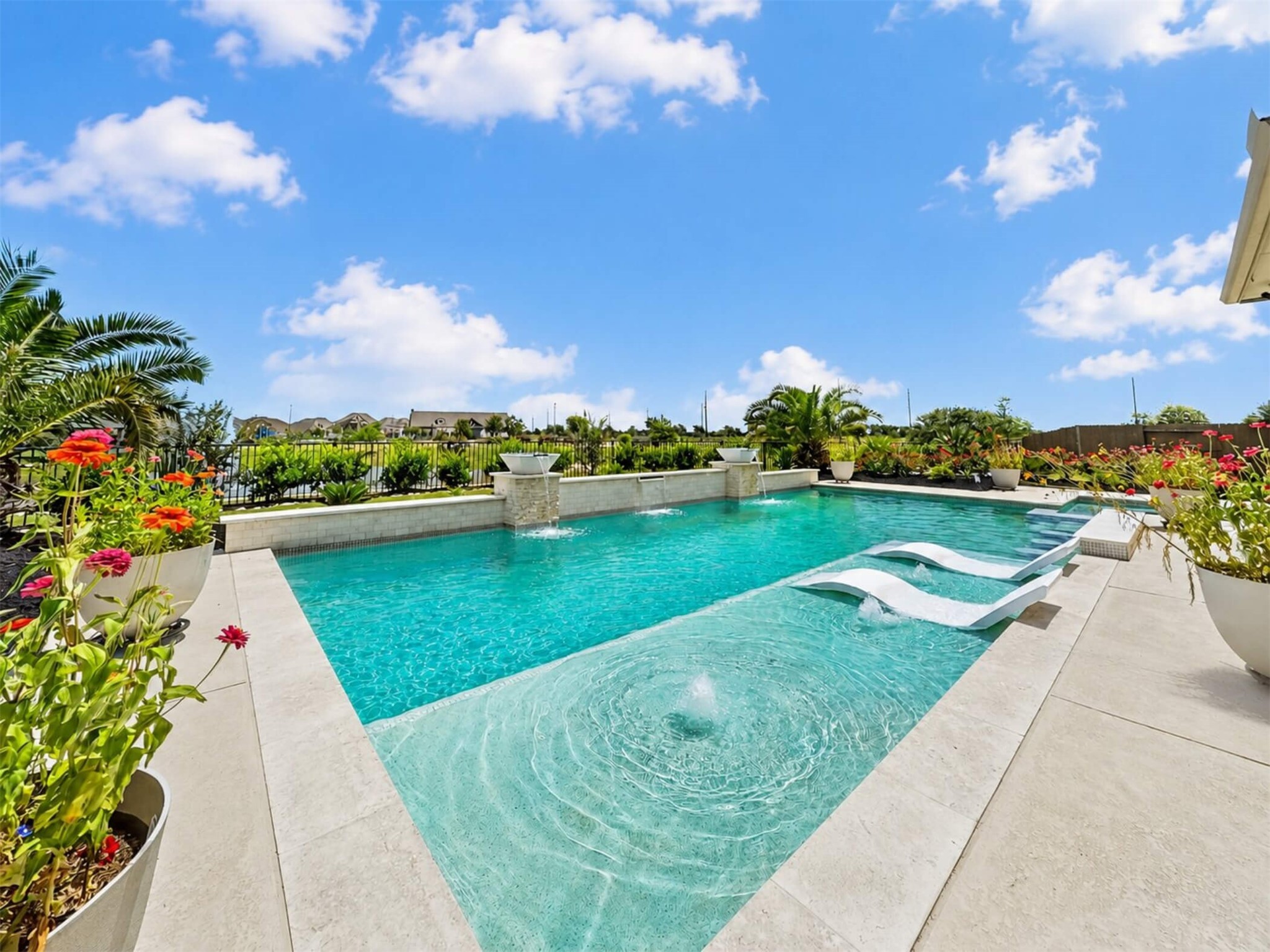 4343 Martin Ridge Drive Manvel, TX 77578 - Photo 40 of 50 a view of a lake with a garden