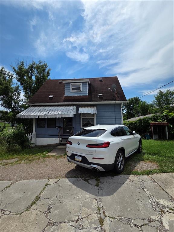 a car parked in front of a house