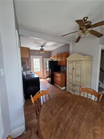 a view of a livingroom with furniture and a flat screen tv