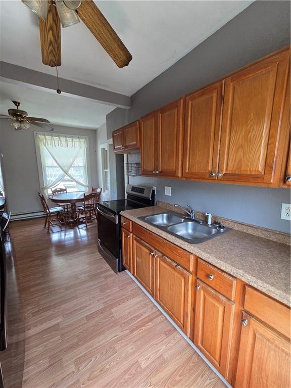 509 Forest Street Monessen, PA 15062 - Photo 3 of 25 a kitchen with stainless steel appliances granite countertop wooden cabinets a stove top oven a sink and dishwasher