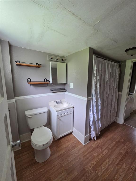 509 Forest Street Monessen, PA 15062 - Photo 4 of 25 a bathroom with a toilet a sink and a shower