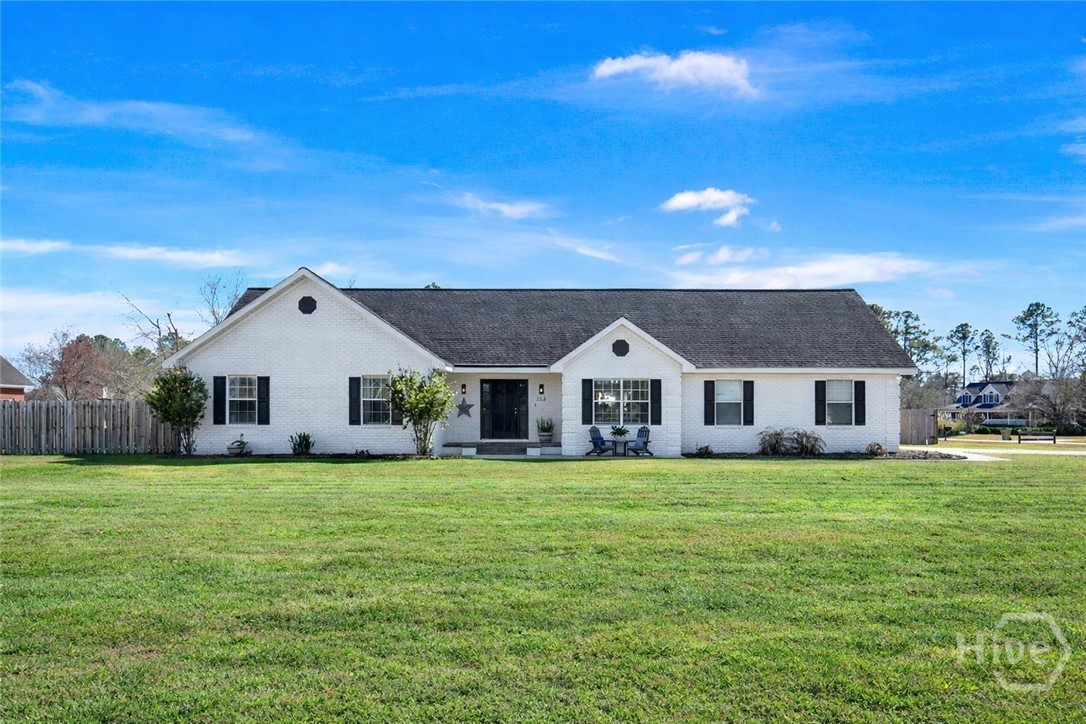 253 Scuffletown Road Guyton, GA 31312 - Photo 1 of 37 Charming all-brick ranch set on a spacious lot with inviting curb appeal and expansive front yard.