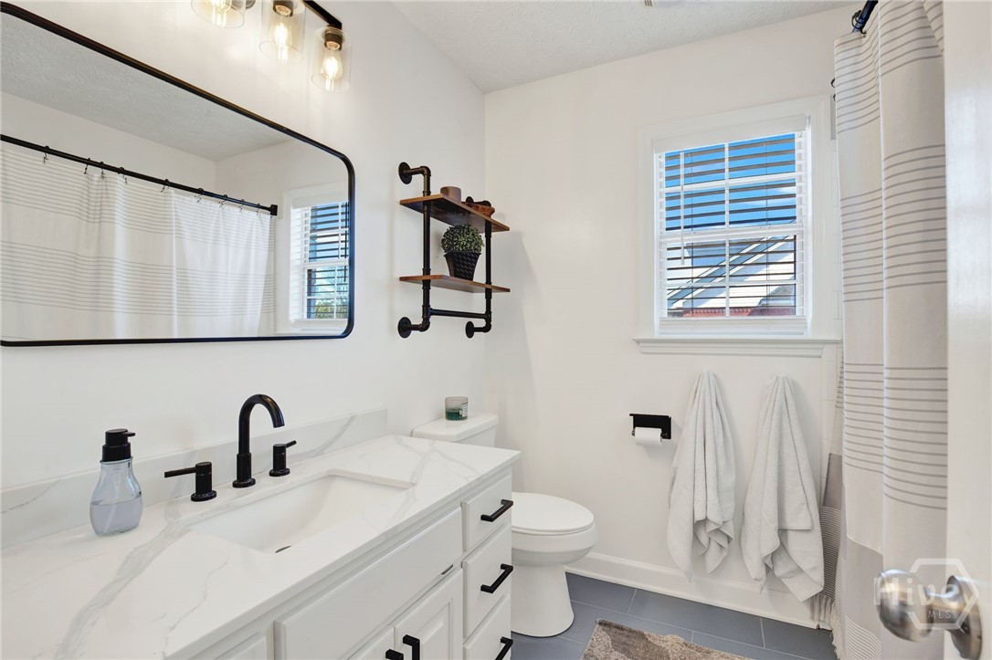 253 Scuffletown Road Guyton, GA 31312 - Photo 13 of 37 Bright and refreshed bathroom featuring a modern vanity, updated fixtures, and clean, timeless finishes.