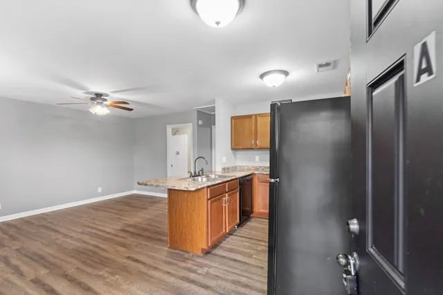 a view of a kitchen from the hallway