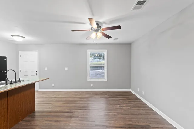 a view of a kitchen from the ceiling fan