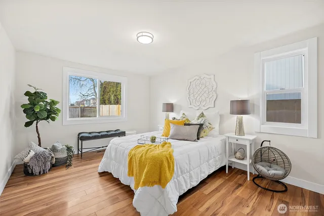 a bed room with a bed and a chandelier