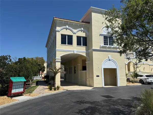 a front view of a house with parking