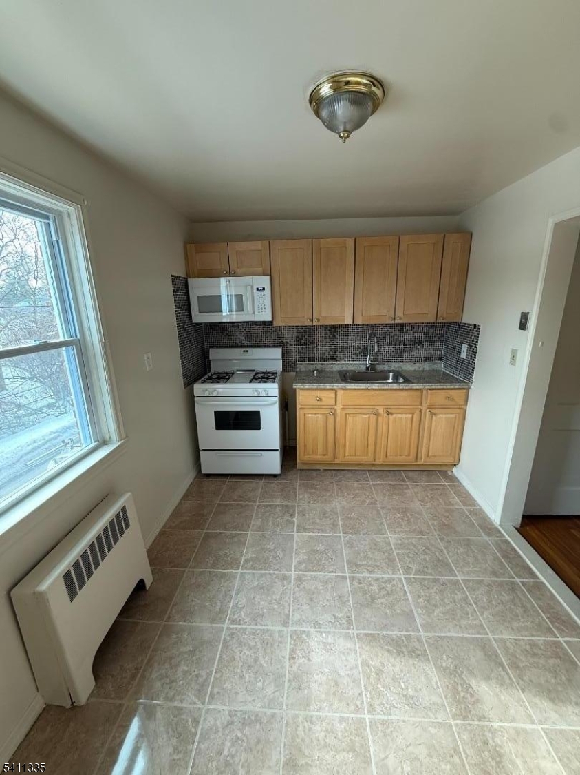 364 Orange Road, Unit B1 Montclair, NJ 07042 - Photo 2 of 4 a view of kitchen with granite countertop cabinets and window